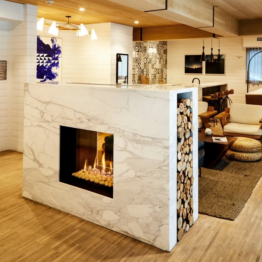 Completed floor-to-ceiling fireplace remodel with modern surround