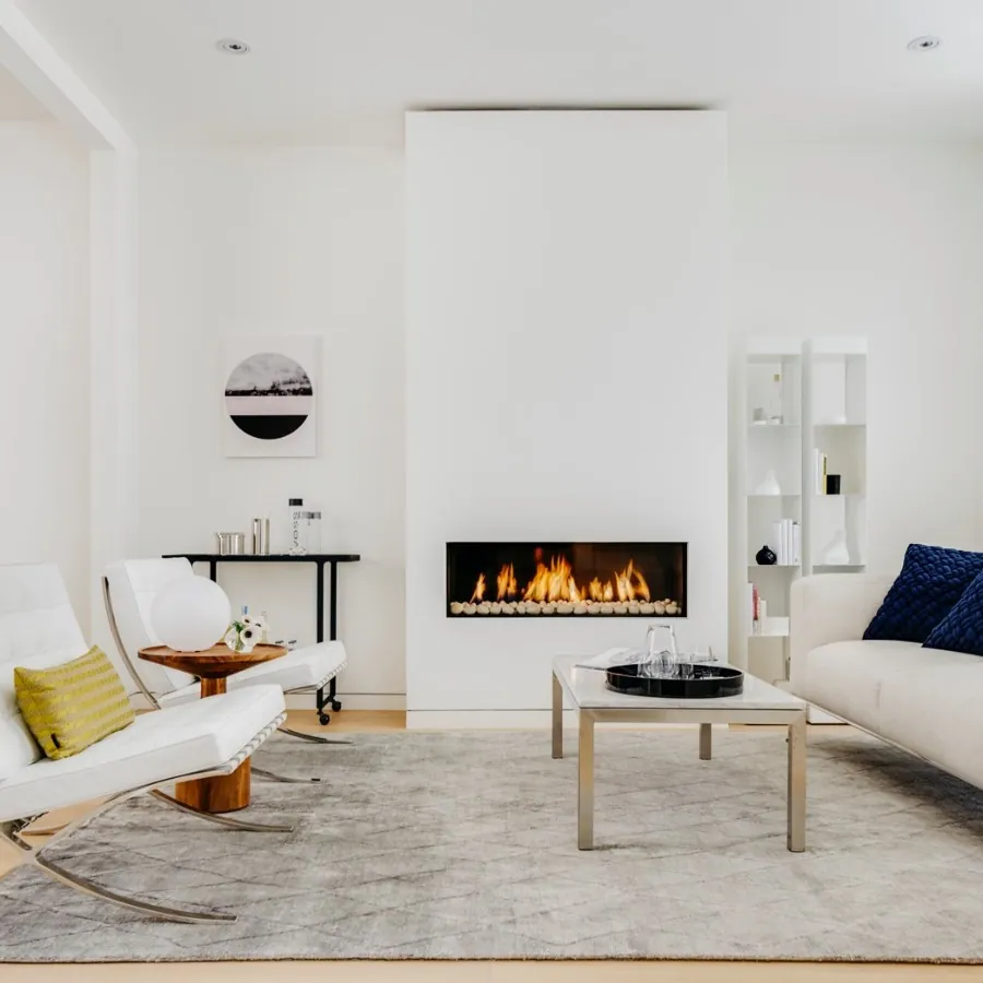 Designer fireplace remodel with custom millwork surround