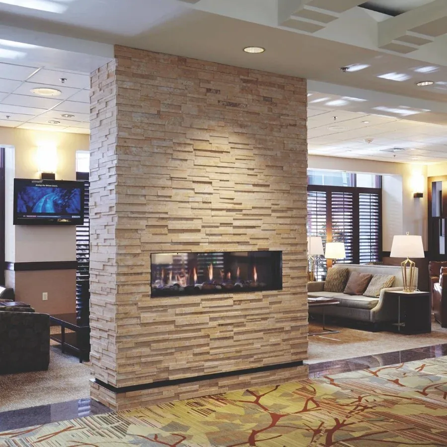 See-through commercial gas fireplace installation in a modern space