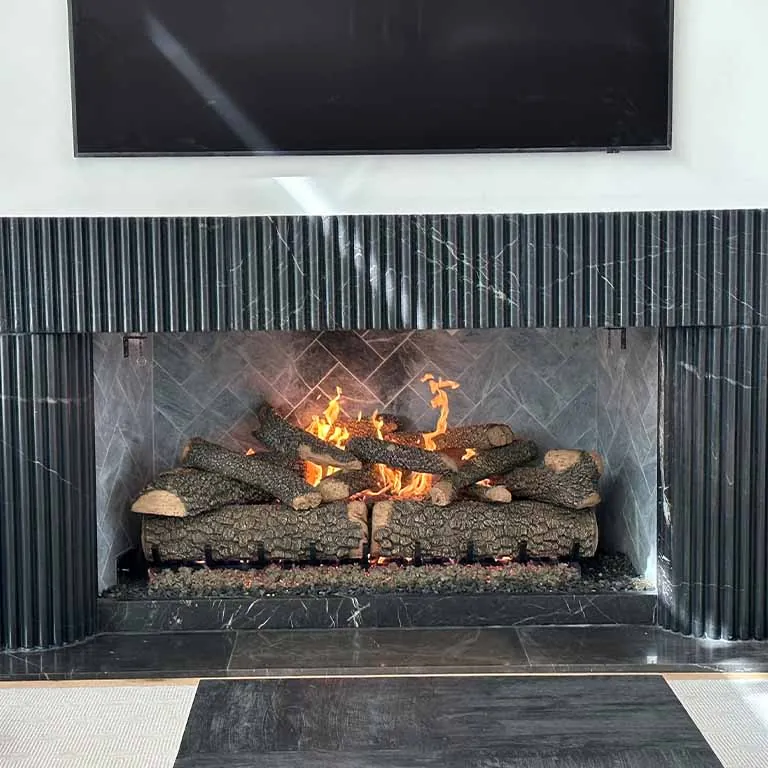 Fluted black fireplace feature wall