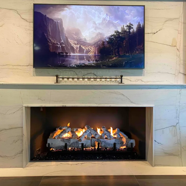 Oversized gas log set installed in a commercial fireplace