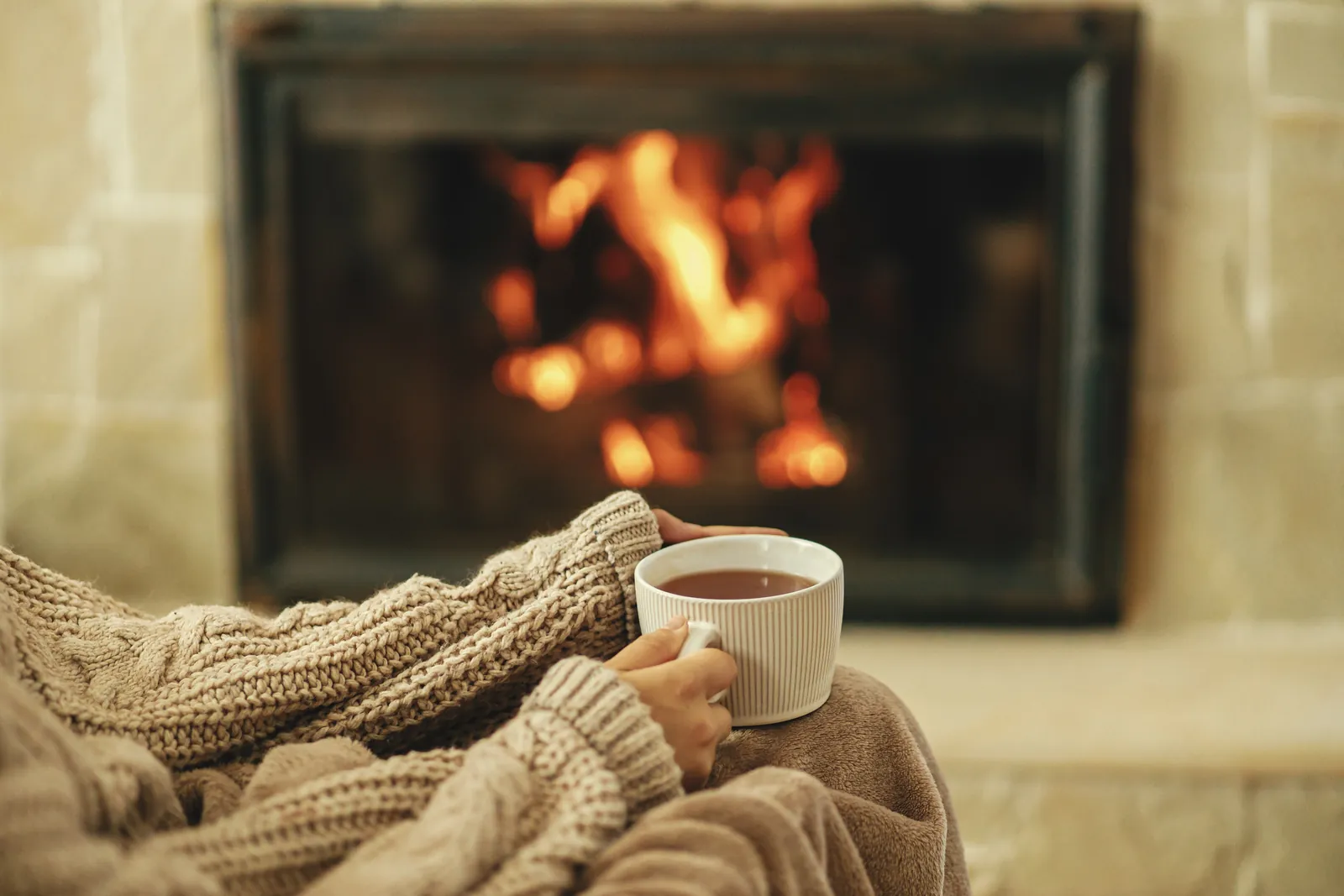 Technician performing annual maintenance on a gas fireplace