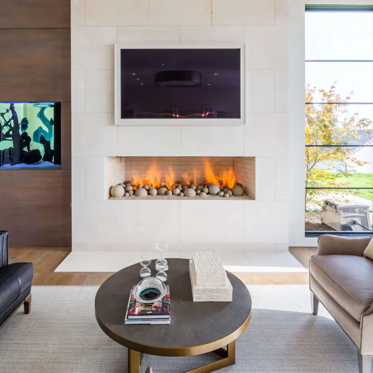 Contemporary fire sphere installation in an open fireplace